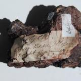 Siderite
Carn Brea Mine, Illogan, Cornwall, England, United Kingdom.
Detail of attached label. (Author: Edelmin)