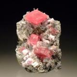 Rhodochrosite with fluorite, pyrite & apatite
Nates Pocket, Sweet Home Mine, Alma, Colorado, USA
4.5x3.3cm
This is my honeymoon rock, our honeymoon just happened to coincide with the Australian Gemboree :) (Author: Greg Lilly)