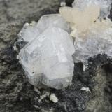 Phillipsite with calcite on basalt.
"Alter Stein" quarry, Allendorf, Umtal, Westerwald, Hessen, Germany.
4cm specimen with Marburg cross twins to 1 cm. (Author: Ru Smith)