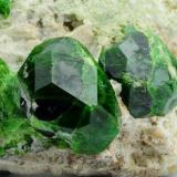 Andradite (var: Demantoid)
Belqeys Mountain (Kuh-e-Belgheys), Takab, West Azarbaijan Province, Iran
Larger crystal is 1.6 cm. The specimen is 5 cm in length (Author: vhairap)