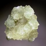 Fluorite
El Gaudro Mine, Talampaya, La Rioja, Argentina
6.2 x 7.1 cm.
Multiple, intergrown, pale green fluorite octahedrons with frosted faces on a quartz matrix. (Author: crosstimber)