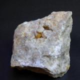 Azufre
La Serrata, Lorca, Murcia, España
8 x 8 x 6 cm
Cristal bien formado de azufre sobre matriz de calcita y caliza. Mide 0,7 cm. Fluorescentes tanto el azufre como la calcita. (Autor: Antonio Alcaide)