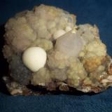 Cuarzo (var. Calcedonia), Cuarzo
Corta San Valentín, Sancti Spiritu, Sierra Minera de Cartagena-La Unión, La Unión, Murcia, España
6 x 6 cm y cristal de cuarzo 1 x 1 cm
Colección José F. Castro Medina (Autor: Jose F. Castro Medina)