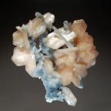 Stilbite
Jalgaon District, Maharashtra, India
7.0 x 7.7 cm.
Pale salmon-colored stilbite crystals on stalactitic drusy blue-gray chalcedony. Collected in 2005. (Author: crosstimber)