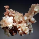 Apophyllite-(KF)
Kolhar, Ahmednagar District, Maharastra, India
9.0 x 11.0 cm.
Colorless to pale pink crystals of apophyllite-(KF) and stilbite covering a coral-like growth of pink chalcedony. Collected in 2005. (Author: crosstimber)