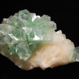 Apophyllite-(KF)
Rahuri, Ahmednagar District, Maharashtra, India
6.0 x 10.1 cm.
A semi-spherical group of mint-green prismatic crystals on white stilbite. (Author: crosstimber)