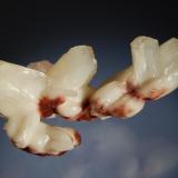 Stilbite
Shakur, Ahmednagar District, Maharashtra, India
5.6 x 9.8 cm.
Sheaves of white to buff-colored stilbite with reddish iron stains commonly seen from this locality. (Author: crosstimber)