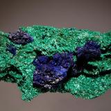 Azurite and Malachite
Bou Bekker, Touissit, Oujda-Angad Province, Oriental Region, Morocco
5.0 x 10.6 cm.
Dark blue crystallized azurite associated with almost fibrous green malachite. (Author: crosstimber)