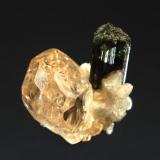 Topaz
Chamachhu, Haramosh Mts., Skardu District, Baltistan, Gilgit-Baltistan, Pakistan
1.8 x 2.3 cm.
Terrible photo of a sherry-colored topaz with albite and elbaite. (Author: crosstimber)