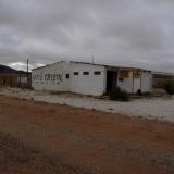 Just 5 km from Blesberg (close to the Namibia border) is the entrance to another mine, Swartberg.  The building in the picture was a little roadside shop.  When the owner, who also sold minerals, died the place closed down and was plundered. (Author: Pierre Joubert)