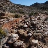 Another smoky quartz vein that was mined for, possibly, smoky quartz crystals. (Author: Pierre Joubert)