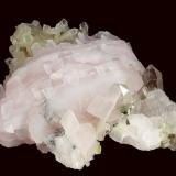 Calcite ( var. Manganoan ) with Quartz
Huanggangliang Fe mine, Kèshíkèténg Qí, Chifeng Prefecture, Inner Mongolia A.R., China

92 x 71 x 52 mm

Bright light pink manganoan-Calcite to 55 x 40 x 7 mm with light-smoky Quartz scepters to 14 mm (Author: GneissWare)