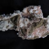 Stilbite + Chabazite
Moonen Bay, Isle of Skye, Scotland, UK
19cm x 12cm x 8cm
The other side of the specimen showing the basalt matrix and areas of pink chabazite and scattered stilbite crystal groups. (Author: Mike Wood)