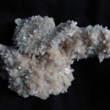 Stilbite + Chabazite
Moonen Bay, Isle of Skye, Scotland, UK
19cm x 12cm x 8cm
Large specimen, mostly covered with ’stubby’ stilbite crystals on this side. Self-collected March 2013. (Author: Mike Wood)