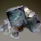 Fluorite
Chashan Mine, Linwu Co., Chenzhou Pref., Hunan Prov., China
4.5 x 6.0 cm
Intergrown group of gemmy bluish-green fluorite crystals resting on a crystallized quartz matrix. (Author: crosstimber)