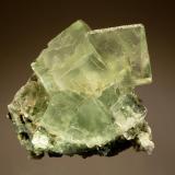 Fluorite
Xianghuapu Mine, Linwu Co., Chenzhou Pref., Hunan Prov., China
5.5 x 6.5 cm
Pale green, transparent crystals with cube {100} and dodecahedron {110} forms. (Author: crosstimber)