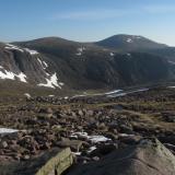 The Cairngorms in early June this year. Still quite a lot of the winter’s snow about. On the plus side there were no midges. The mountain in the distance is called ’Cairngorm’, after which the range of mountains is named. It’s summit is 1244m, over 4,000 ft above sea level. Everywhere is granite. (Author: Mike Wood)