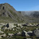 The East side of Ben a’ Bhuird is fringed with precipitous cliffs and corries, formed during the last ice-age, resulting in lots of exposed granite rock. There are not many pegmatites to see around here though, and what you find in exposures tend to be thin and stringy. (Author: Mike Wood)