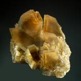 Barite
Xichang Co., Liangshan Aut. Pref., Sichuan Prov. China
7.2 x 8.5 cm
Sharp, chiesel-shaped, golden-brown, barite crystals with steep terminations and subtle color zoning. (Author: crosstimber)