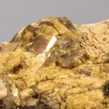 Beryl + Microcline + Smoky Quartz + Muscovite
Ben a’ Bhuird, Cairngorm Mountains, Grampian Region, Scotland, UK
10cm x 7cm x 3cm
Close-up of the above specimen. The beryl crystal reflecting the light is 10mm long. (Author: Mike Wood)