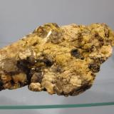 Beryl + Microcline + Smoky Quartz + Muscovite
Ben a’ Bhuird, Cairngorm Mountains, Grampian Region, Scotland, UK
10cm x 7cm x 3cm
Random lump of pegmatite found on it’s own on the ground. The beryl crystals are a strong yellow colour but are opaque. (Author: Mike Wood)