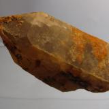 Quartz
Shelter Stone Crag, Caingorm Mountains, Grampian Region, Scotland, UK
70mm x 35mm x 30mm
A fairly large but rough looking quartz crystal. It is somewhat translucent and not smoky, and appears to have an overgrowth or second generation of quartz. Found this and several small crystals near the top of Shelter Stone Crag, by carefully climbing down a &rsquo;bottomless&rsquo; gully a short distance (not the gully in the previous photo). Couldn&rsquo;t do much poking about as I was acutely aware of the sickening drop below me, and the possibility of climbers somewhere below. (Author: Mike Wood)