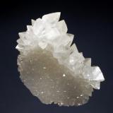 Calcite
Wenshan Mine, Wenshan Co., Yunnan Prov., China
5.7 x 7.3 cm
A thin plate composed of small colorless calcite crystals with a second generation of larger scalenohedral calcites lining the top of the plate. (Author: crosstimber)