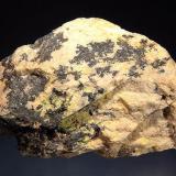 Uraninite
Ruggles Mine, Grafton, Grafton Co., New Hampshire, USA
5.0 x 7.5 cm
Black uraninite and minor yellow autunite on a light-colored feldspar matrix. (Author: crosstimber)