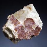 Lepidolite
Mt. Mica, Paris, Oxford Co., Maine
4.0 x 5.3 cm
Micaceous lilac-colored lepidolite embedded in white albite var. 
cleavelandite. (Author: crosstimber)