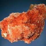 Inesite
N’Chwaning II Mine, Kuruman, N. Cape Prov., South Africa
7.0 x 9.5 cm
Acicular salmon-colored inesite crystals on a vuggy brown matrix with a few colorless micro-crystals of apophyllite on the bottom of the specimen. (Author: crosstimber)