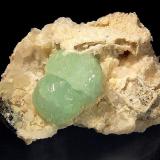 Prehnite
Goboboseb Mts., Brandberg area, Erongo Region, Namibia
5.5 x 7.1 cm
Two mint green spheres of prehnite implanted on a calcite and quartz matrix. (Author: crosstimber)