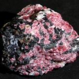 Eudialyte, Aegirine
Mont Saint-Hilaire, Canada
4,5 x 4 x 4 cm
Many of the minerals originally described from Ilímaussaq or the Kola complexes were later also reported from Mont Saint-Hilaire, although I have the impression that mostly in micros. 

I highly recommend the album of Doug Merson here in the FMF where we have many gorgeous micros from there. (Author: kakov)