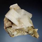 Orthoclase var. adularia
Tyrol, Austria
7.1 x 9.3 cm
Colorless adularia crystals associated with fibrous white to greenish byssolite. (Author: crosstimber)