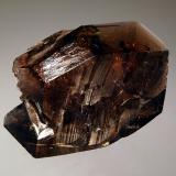 Axinite-(Fe)
Puiva Mount, Saranpaul, Tyumenskaya Oblast, Prepolar Ural, Western Siberian Region, Russia
3.1 x 4.5 cm
Glassy sharp brown bladed crystal of axinite-(Fe). (Author: crosstimber)