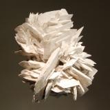 Glauberite
Lake Bumbunga, Lockiel, Mt. Lofty Ranges, South Australia
5.0 x 6.1 cm
An intergrown group of colorless bladed glauberite crystals with a thin white coating of epsomite. (Author: crosstimber)