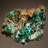 Cerussite
Brown’s Prospect, Rum Jungle, Batchelor, Northern Territory, Australia
7.1 x 8.2 cm
Pale yellowish-brown to cream-colored crystals of cerussite associated with velvety green botryoidal malachite. (Author: crosstimber)