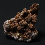 Smithsonite on fluorite
Ball Eye Mine, Bonsall, Derbyshire, England, UK
Brown botryoidal smithsonite encrusting fluorite cubes, max dimension ~ 50 mm. (Author: Andy Lawton)