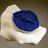 Azurite
Malbunka Cu Mine, Western Aranda country, Areyonga, Northern Territory, Australia
6.3 x 8.0 cm
Ovate leaf-shaped azurite sun with shallow concentric ridges on a matrix of pale gray kaolinite. (Author: crosstimber)