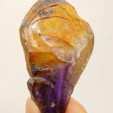 Quartz variety amethyst.
Brandberg Area, Erongo, Namibia
53 x 29 x 20 mm
A batch of these ’mysterious’ quartz crystals with a yellow coating that can not be removed with the usual acids and small unknown crystals, surfaced in the first few years of this century and apparently not again. (Author: Pierre Joubert)