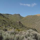 You can see some of the road ahead in the far distance, and part of the mine which is light brown in color (Author: John S. White)