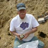 Ken Roberts, veteran mineral dealer, with another quartz find. (Author: Tony L. Potucek)