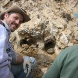 Ian Merkel, an exposed quartz pocket, and Scott Werschky.  Ian is a senior geologist working at FMI-Climax&rsquo;s Henderson mine (Mo) in Colorado, and Scott is a noted mineral dealer known as Mr. Round Mt. gold boy. (Author: Tony L. Potucek)