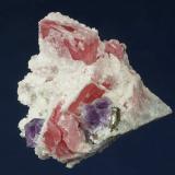 Rhodochrosite with FluoriteLamo-Longxianggai, Dachang District, Nandan, Hechi Prefecture, Guangxi Zhuang Autonomous Region, China43 x 41 x 38 mm (Author: GneissWare)