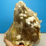 Quartz var. smoky, feldspar, dolomite and rutile
Van Rhynsdorp, Western Cape South Africa.
195 x 160 x 130 mm
One of the larger specimens of quartz that I collected. It weighs just more than 3 kg. (Author: Pierre Joubert)