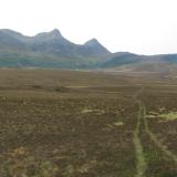 Ben Loyal, Sutherland, Scotland
I walked from the tent towards the mountain across the heathery moorland and bog. There was a farmer’s quad bike track to follow in places which made things easier. (Author: Mike Wood)