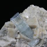 Beryl variety Aquamarine
Raikot (Raikoot), Chilas, Diamar District (Diamir District), Gilgit-Baltistan (Northern Areas), Pakistan
8.9 x  4.7 x 3.0 cm
Blue-cap aquamarine on twinned microcline (Author: Don Lum)