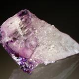 Fluorite
Elmwood Mine, Carthage, Smith County, Tennessee, USA
4.7 x 8.3 cm
The Elmwood mines were noted for producing these naturally etched fluorite crystals. These fluorites generally consist of a etched cone-shaped interior topped by a remnant cubic corner. (Author: crosstimber)