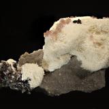 Celestine
Cumberland Mine, Carthage, Smith County, Tennessee, USA
5.0 x 8.5 cm
One of the less frequently seen minerals from Elmwood - creamy white acicular celestine with dark brown sphalerite and pale purple fluorite cubes. (Author: crosstimber)