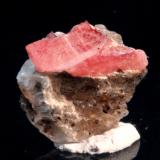 Nambulite, Gypsum
Kombat Mine, Kombat, Grootfontein District, Otjozondjupa Region, Namibia
1.0 x 1.0 x 0.7 cm
ex Chris Stefano
Partial tabular pink-red translucent crystal of nambulite on gypsum. (Author: Don Lum)