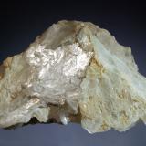 Brucite
Wood’s Chrome Mine, Texas, Lancaster Co., Pennysylvania, USA
6.6 x 10.4 cm
Triangular plate of colorless brucite with a laminated structure and pearlescent luster. (Author: crosstimber)